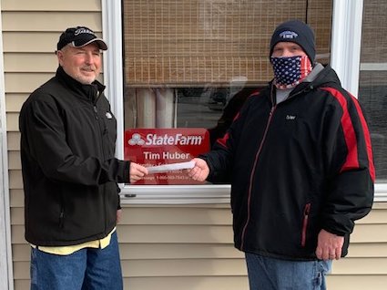 State Farm insurance agent Tim and Liz Huber of Nokomis presented a $1,000 donation to the Nokomis Memorial Park Pool project on Tuesday, Dec. 15. Above, from the left, are Tim Huber and Tyler Batty, fundraising coordinator for the pool project.